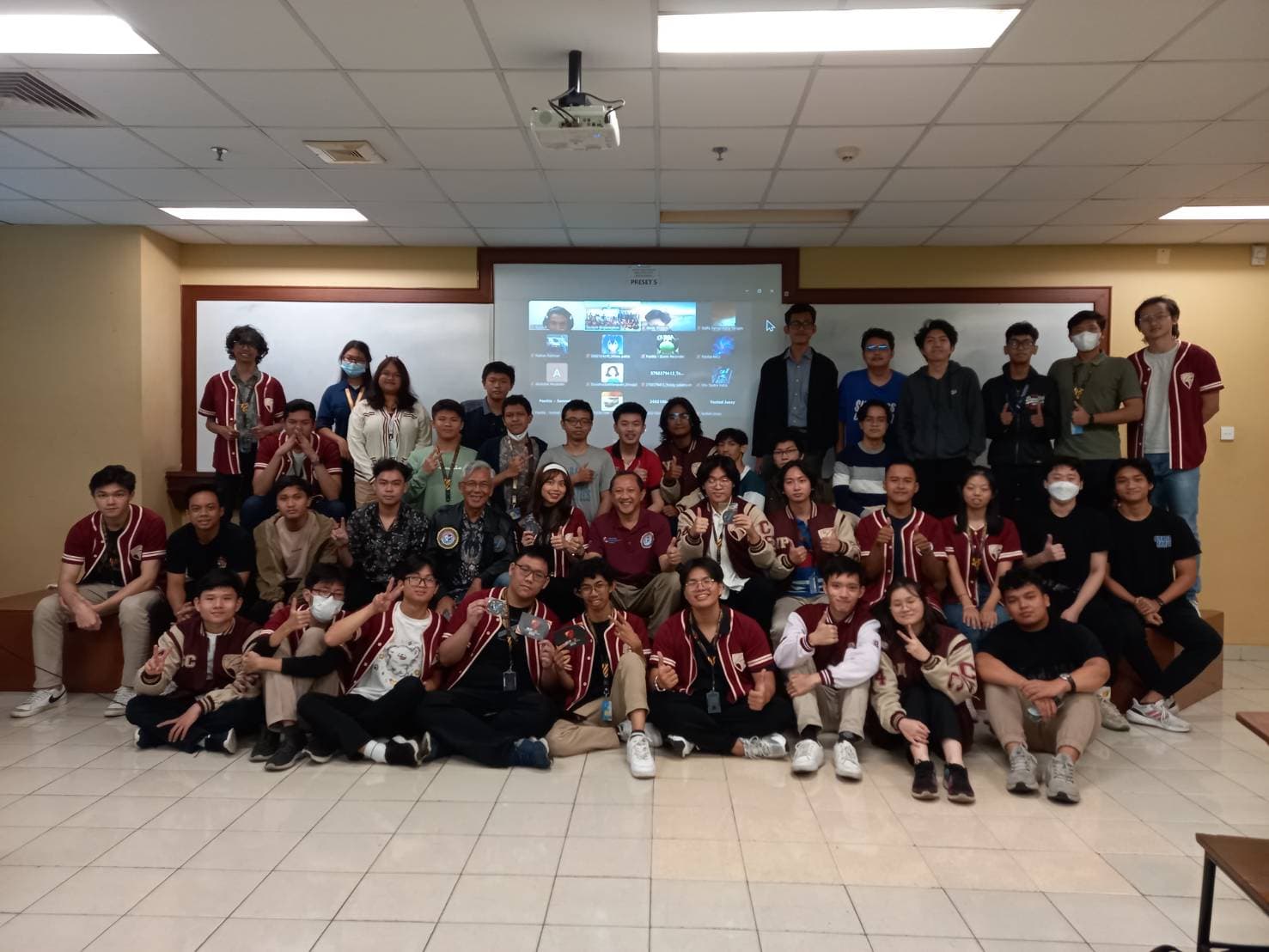Large group photo in lecture room during celebration